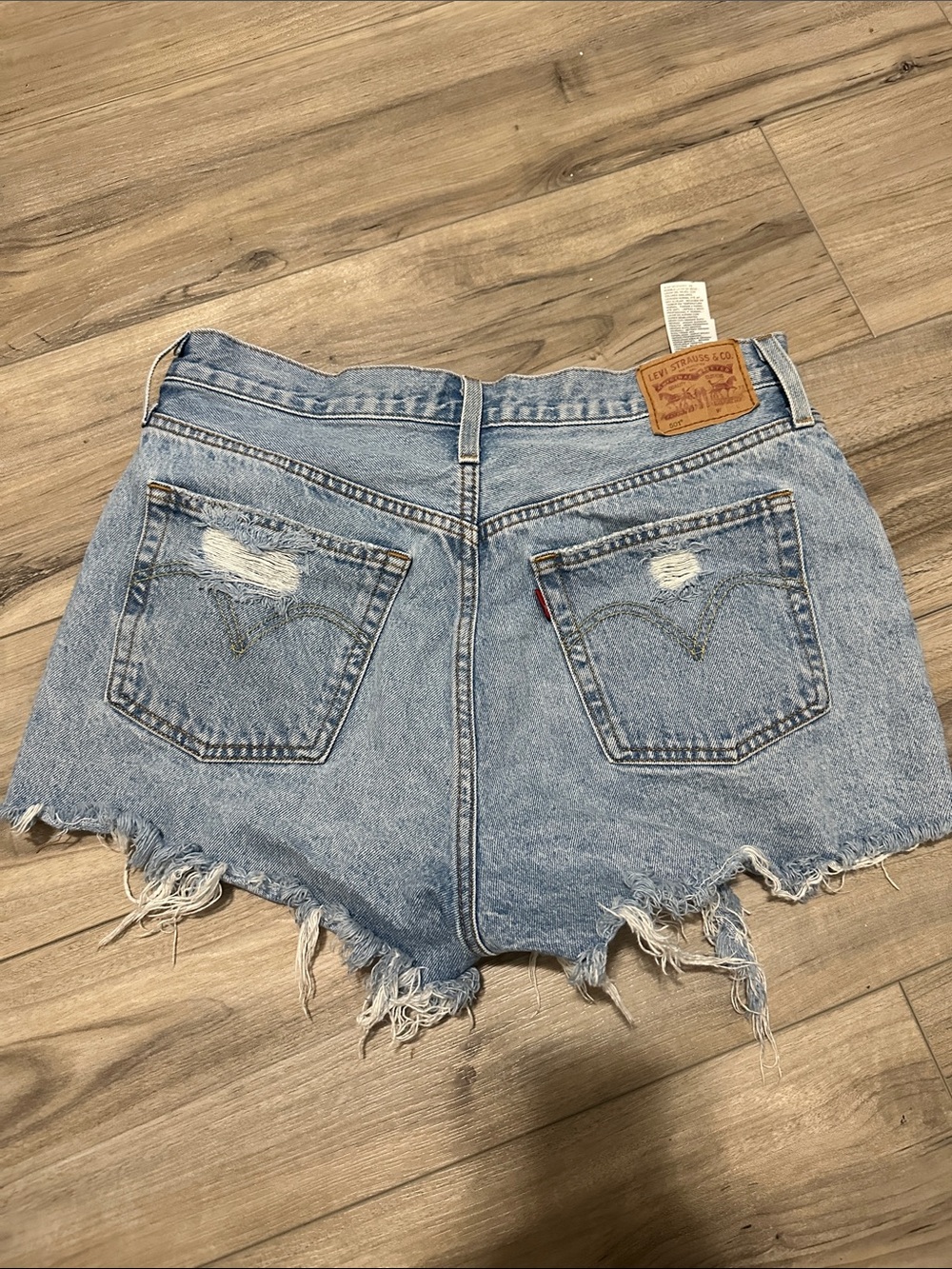 Levi’s High-Rise Distressed Light Blue Denim Shorts - Picture 2 of 2